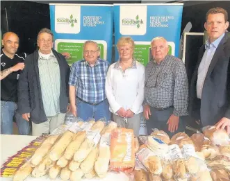  ??  ?? AM Rhun ap Iorwerth AM with Anglesey Food Bank volunteers Ben Lipman, Miachael Chard, Gwyneth Hewitson, Roy Fyles and Martin Brooks