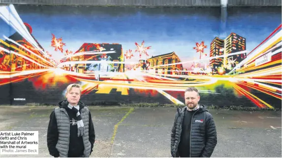  ?? Photo: James Beck ?? Artist Luke Palmer (left) and Chris Marshall of Artworks with the mural