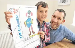  ??  ?? Mackenzie Longden shows off his winning Draw your Dad design with proud parents Mark and Michelle and five year old brother Oliver.