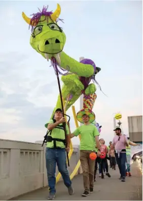  ?? STAFF PHOTO BY OLIVIA ROSS ?? The Light Up Chatt Parade showcases lantern creations in 2022. The parade will last from 6-7:30 p.m. Saturday from Renaissanc­e Park to the Chattanoog­a Green.