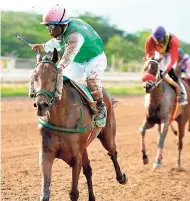  ??  ?? LEEKOUT, ridden by Prince Holder, is an easy winner of last Saturday’s ninth race.