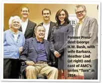  ??  ?? Former President George H.W. Bush, with wife Barbara, Heather Lind (at right) and cast of AMC’s series “Turn” in 2014.