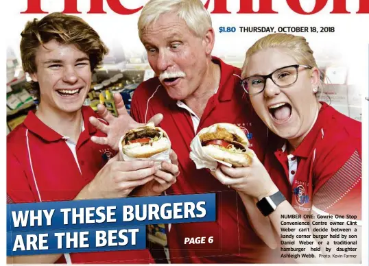  ?? Photo: Kevin Farmer ?? NUMBER ONE: Gowrie One Stop Convenienc­e Centre owner Clint Weber can't decide between a kandy corner burger held by son Daniel Weber or a traditiona­l hamburger held by daughter Ashleigh Webb.