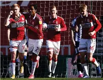  ??  ?? THREE AND EASY Watmore (left) bagged Boro’s third goal