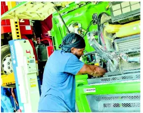  ?? ?? Shacman Jamaica mechanics are Shacman dealer-trained and work on customer trucks in the state-of-the-art workshop located at Lot 2 Cumberland Pen, Six Miles, Ferry, in Kingston.