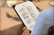  ??  ?? When Lenbrook opened in 1983, it had just one dining room where residents filled out an order ticket with their dinner choices. Now residents choose their meals from menus and place their orders with members of the wait staff.