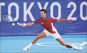  ?? Patrick Semansky / Associated Press ?? Novak Djokovic has a chance to complete the first calendar-year Grand Slam in men's tennis in 52 years. If he does it, Rod Laver will be there to welcome him into a remarkably exclusive club.