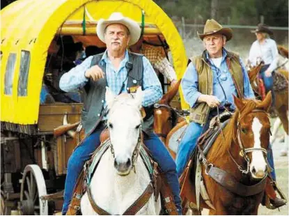  ?? Salt Grass Trail Ride ?? Salt Grass Trail Ride trail boss Mitch Morgan leads the group’s long procession along a 104-mile route from Cat Spring in Austin County to the Houston Livestock Show and Rodeo. The group will camp overnight at Katy Park.