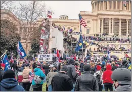  ?? JASON ANDREW/NEW YORK TIMES ?? A pro-Trump mob storms the Capitol in Washington after a rally where the president spoke on Jan. 6.