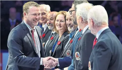  ?? FRANK GUNN THE CANADIAN PRESS ?? Hockey Hall of Fame inductee Martin Brodeur shakes hands with hall personalit­ies before Friday’s game in Toronto.