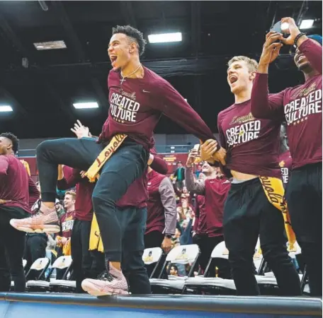  ?? Armando L. Sanchez, Chicago Tribune ?? Junior guard Marques Townes, left, celebrates with his Loyola Chicago teammates on their campus Sunday after the Ramblers (28-5) were slotted into the 68-team NCAA Tournament bracket during the selection show on TBS.