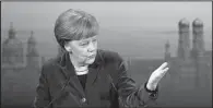  ?? AP/MATTHIAS SCHRADER ?? German Chancellor Angela Merkel speaks Saturday in Munich, where she warned of the risk of “uncontroll­able escalation” in Ukraine and said more weapons will not help solve the conflict.