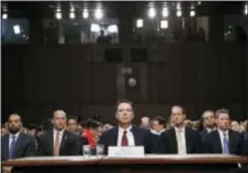  ?? ALEX BRANDON - THE ASSOCIATED PRESS ?? Former FBI director James Comey listens to the committee chairman at the beginning of the Senate Intelligen­ce Committee hearing on Capitol Hill, Thursday.