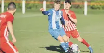  ??  ?? Whitley Bay (blue and white) take on Seaham Red Star last weekend.