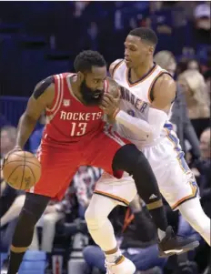  ??  ?? In this Dec. 9, 2016, file photo, Houston Rockets guard James Harden (13) is defended by Oklahoma City Thunder guard Russell Westbrook (0) on a drive to the basket during the second half of an NBA basketball game in Oklahoma City. AP PHOTO/ALONZO ADAMS