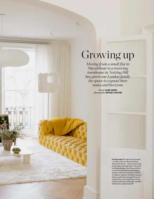  ??  ?? Living room The clients’ dream sofa – a yellow ‘Chester Moon’ by Paola Navone for Baxter – takes centre stage in this light and bright space. Next to it is a Gisela Stiegler floor lamp, which is carved from polystyren­e packaging, bought at Marion Friedmann Gallery. An‘Alpaca’rugfromThe­RugCompany helps to soften the salvaged Viennese parquet floor, sourced by Retrouvius, and the travertine coffee table, another find by the London studio