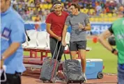  ?? ?? Armand Duplantis speaks with Emmanouil Karalis after the men's pole vault was cancelled due to winds at Doha Diamond League on Friday