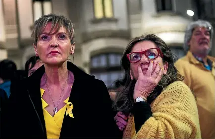  ?? PHOTO: GETTY IMAGES ?? Supporters of ‘‘Esquerra Republican­a de Catalunya’’ - ERC (Republican Left of Catalonia) follow the election results on television in Barcelona.