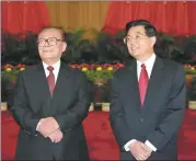  ?? ?? Jiang Zemin and Hu Jintao, former general secretary of the CPC, meet with delegates of the 16th National Congress in Beijing on Nov 15, 2002.