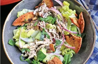  ?? Tns ?? CRISP AND CRUNCHY: Fattoush is a chopped Levantine salad made with stale pita. This version includes shredded chicken tossed in a citrusy tahini-sumac dressing.