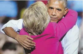  ?? AP PHOTO ?? ON THE TRAIL: President Obama embraces Democratic presidenti­al candidate Hillary Clinton during a campaign rally yesterday.