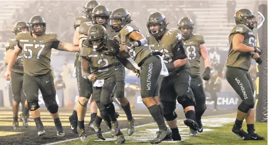  ?? ADAM HUNGER/ASSOCIATED PRESS ?? Army quarterbac­k Tyhier Tyler (2), a Woodside High graduate, celebrates after a 4-yard run for the game’s only touchdown in the Black Knights’ 15-0 shutout Saturday of Navy in West Point, New York.