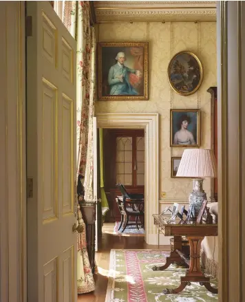  ??  ?? Fig 7 above: A view towards the study showing the surviving historic plasterwor­k and the decorative variety of the new interior. Fig 8 below: The drawing room, where the paintings echo the views of the gardens and the ‘superlativ­e natural landscape’ beyond