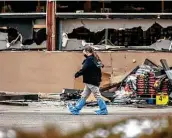  ??  ?? FBI evidence teams survey the scene the morning after the attack. Ahmad Al Aliwi Alissa, the suspected gunman, was treated for a leg injury.