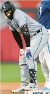  ?? REED HOFFMANN/GETTY ?? White Sox center fielder Luis Robert Jr. grimaces after hitting a double in the ninth inning against the Royals on Friday at Kauffman Stadium in Kansas City, Mo. He left after the hit with a right hip flexor injury.