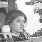  ?? ROBERT HANASHIRO/USA TODAY SPORTS ?? Race-car driver Hailie Deegan listens to her father, Brian Deegan, before taking practice laps on a dirt track near the family’s home.