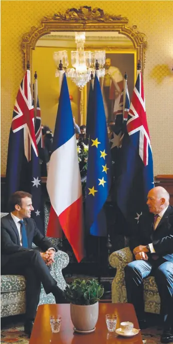  ?? Pictures: AFP/GETTY ?? French President Emmanuel Macron (above left) speaks with the Governor-general of Australia Peter Cosgrove in Sydney yesterday and (left) Mr Macron presents the Legion d’Honneur award to Australian war veteran William Mackay. He was one of three...