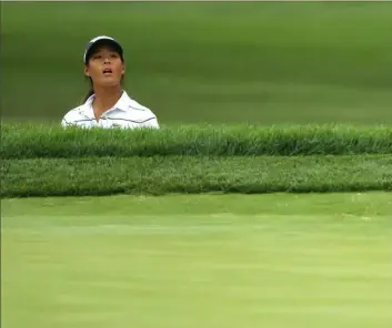  ?? Patrick Smith/Getty Images ?? Co-leader Celine Boutier tries to watch her shot from a bunker Saturday in the second round of the LPGA Drive On Championsh­ip in Toledo, Ohio.