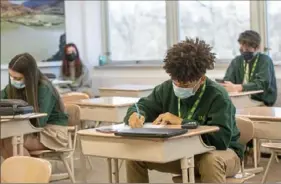  ?? Emily Matthews/Post-Gazette ?? Freshman Nicholas Brown takes a pre-geometry pop quiz at Seton LaSalle Catholic High School in Mt. Lebanon.