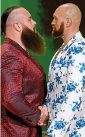  ??  ?? Beards to be feared: Strowman and Fury (right) ahead of their grapple GETTY IMAGES