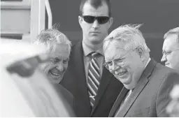  ?? Associated Press ?? n U.S. Secretary of State Rex Tillerson, left, and U.S. Ambassador to Russia John Tefft smile Tuesday upon arrival in Moscow’s Vnukovo airport, Tillerson is due to meet with Russian Foreign Minister Sergey Lavrov on Wednesday.