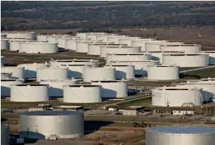  ?? — Bloomberg ?? Oil storage tanks at Cushing, Oklahoma. The prospect of rising output from outside Opec, led by US shale oil producers, could continue to hamper the rebalancin­g process.