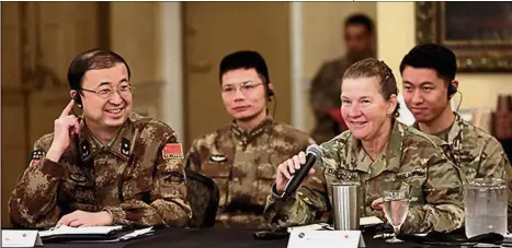  ??  ?? Team spirit: Major- Gen Li Hui (left) of the Political Work Department of the Central Military Commission talking with US Army Major- Gen Susan Davidson at a seminar in Portland, Oregon. — China Daily/Asia News Network