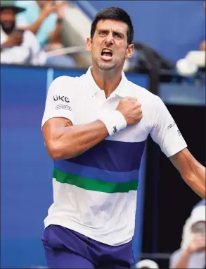  ?? John Minchillo / Associated Press ?? Novak Djokovic reacts after scoring a point against Kei Nishikori during the third round at the U.S. Open on Saturday.