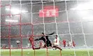  ?? Photograph: Kai Pfaffenbac­h/Reuters ?? Marquinhos finishes confidentl­y to put PSG 2-0 up, shortly before going off injured.