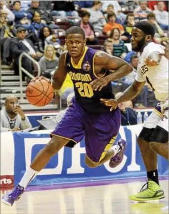  ?? AP FILE ?? Gemil Holbrook, seen in the 2015 PIAA Class 4A final playing for Roman Catholic against Martin Luther King, has attended four colleges in two and a half seasons. The Darby native is hopeful that he’ll find a more permanent home at his latest stop,...