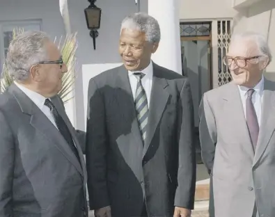  ??  ?? Lord Carrington meets two giants on the world stage, Nelson Mandela and Henry Kissinger