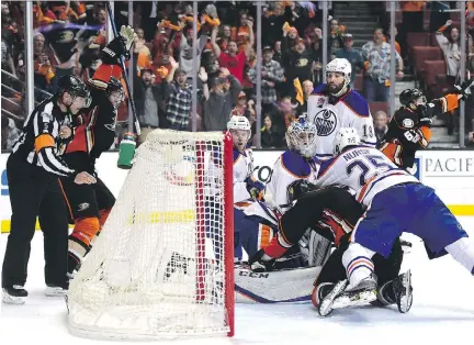  ?? HARRY HOW/GETTY IMAGES ?? Anaheim Ducks centre Ryan Kesler connects with Edmonton Oilers goaltender Cam Talbot in the crease during the waning seconds of the third period in Game 5 on Friday in Anaheim, Calif. The Oilers claimed goaltender interferen­ce, but the goal stood — and...