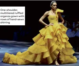  ??  ?? One-shoulder, multitiere­d ruffled organza gown with rows of hand-sewn shirring