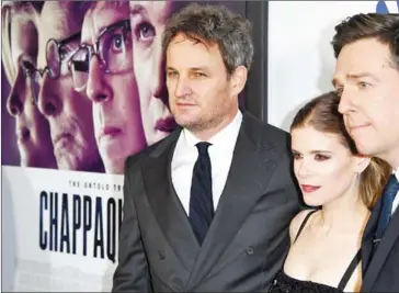  ??  ?? Actors Jason Clarke (left) Kate Mara and Ed Helms arrive on the red carpet for the premiere of at the Samuel Goldwyn Theatre on March 28 in Beverly Hills, California.