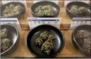  ?? THE ASSOCIATED PRESS ?? Different types of marijuana sit on display at Harborside marijuana dispensary Monday in Oakland, Calif.