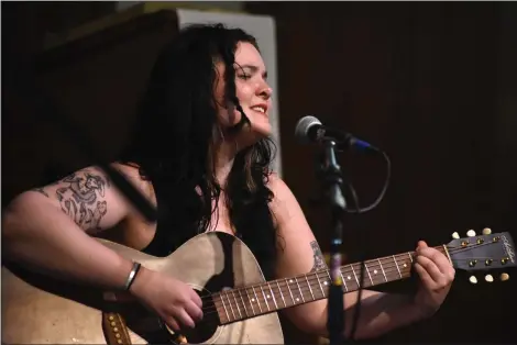  ?? TANIA BARRICKLO — DAILY FREEMAN ?? Calder Mansfield of Phoenicia, N.Y., sings multiple original songs at the Phoenicia Stands With the People of Ukraine fundraiser for the Be A Hero For Ukraine organizati­on. The event took place at the Phoenicia United Methodist Church on Sunday, May 29, 2022, and included musicians, performers, crafts and food.