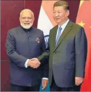  ?? PTI ?? Prime Minister Narendra Modi and Chinese President Xi Jinping meet on the sidelines of the SCO Summit in Astana on Friday.