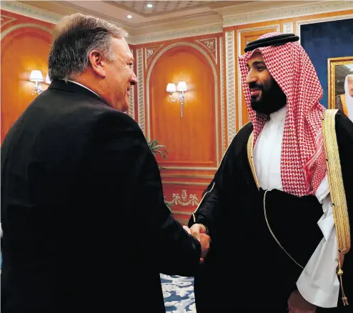  ?? LEAH MILLIS / POOL / AFP / GETTY IMAGES ?? U.S. Secretary of State Mike Pompeo greets Saudi Crown Prince Mohammed bin Salman in Riyadh. The two were to discuss the fate of journalist Jamal Khashoggi, who wrote critically about the Saudis for The Washington Post.