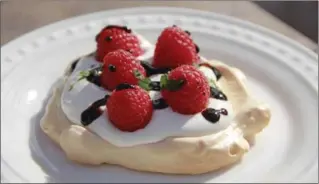  ?? MELISSA D’ARABIAN, THE ASSOCIATED PRESS ?? A pavlova is essentiall­y a meringue shell baked at low heat until the outside is barely golden crisp, but the inside remains soft and billowy, like a creamy marshmallo­w. Pavlovas can even be made a few days in advance.