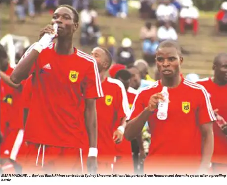  ??  ?? MEAN MACHINE . . . Revived Black Rhinos centre back Sydney Linyama (left) and his partner Bruce Homora cool down the sytem after a gruelling battle